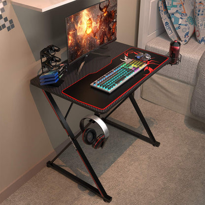31-Inch X-Shape Gaming Desk with Free Mouse Pad, Cup Holder, Headphone Hook, and Controller Stand - Professional Gamer Workstation for Home Office in Black